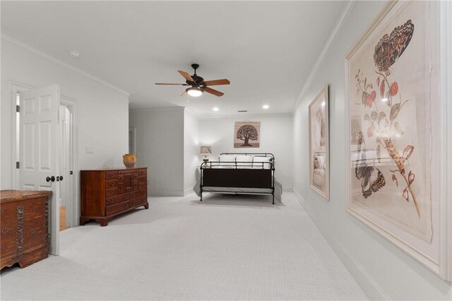 bedroom with carpet, crown molding, and ceiling fan