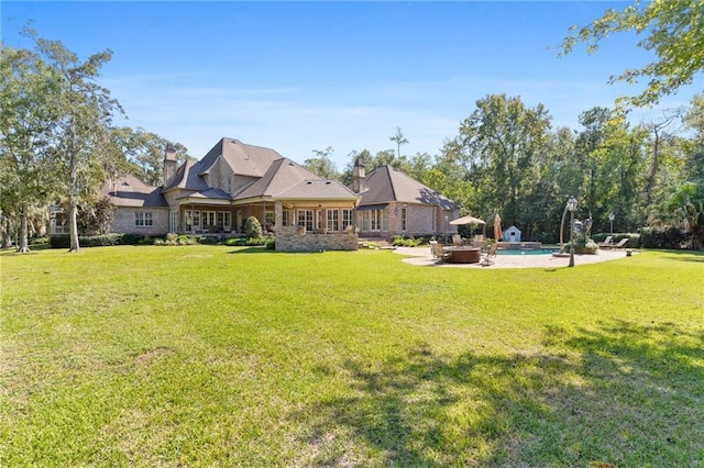 view of yard with a patio area and an outdoor pool