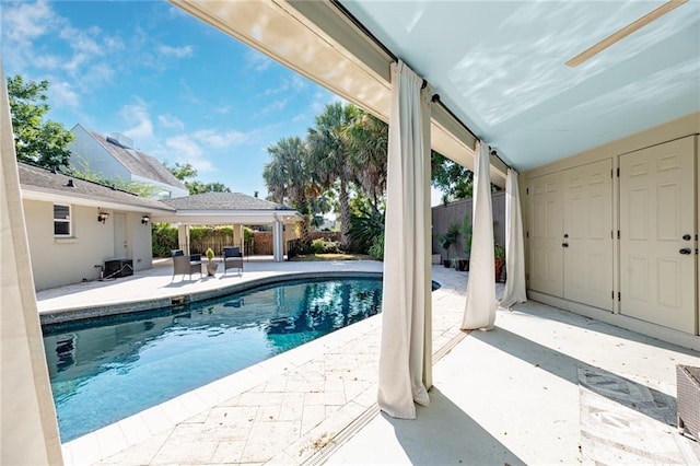 view of swimming pool featuring a patio area