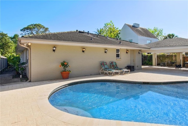 view of pool featuring a patio