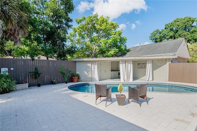 view of swimming pool featuring a patio area