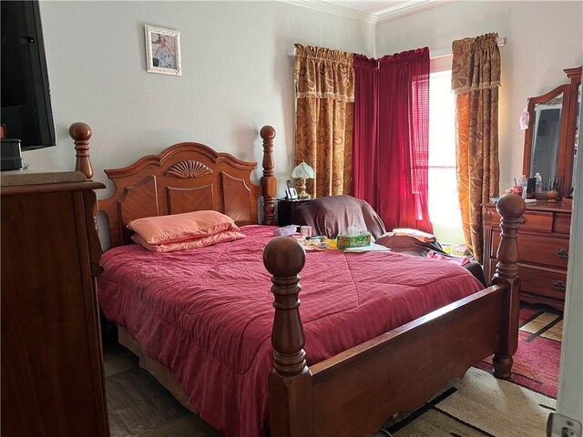 bedroom with ornamental molding