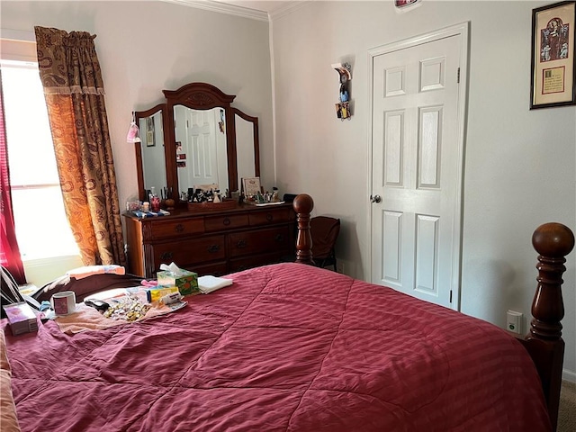 bedroom featuring crown molding