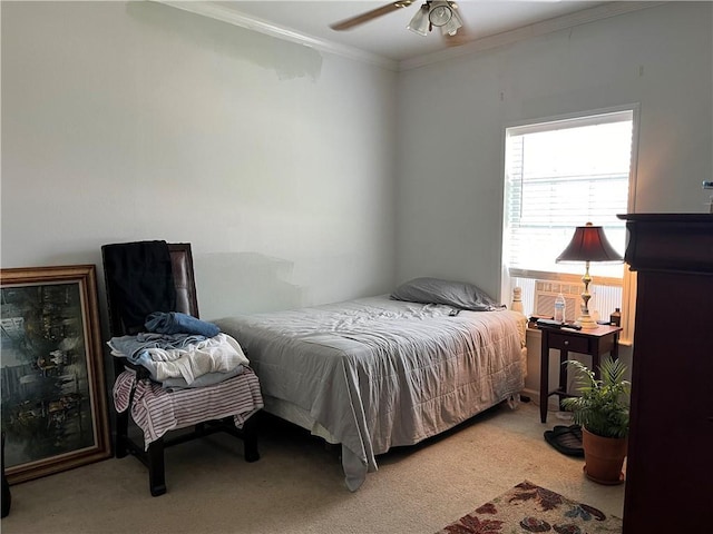 bedroom with light carpet, ceiling fan, and ornamental molding