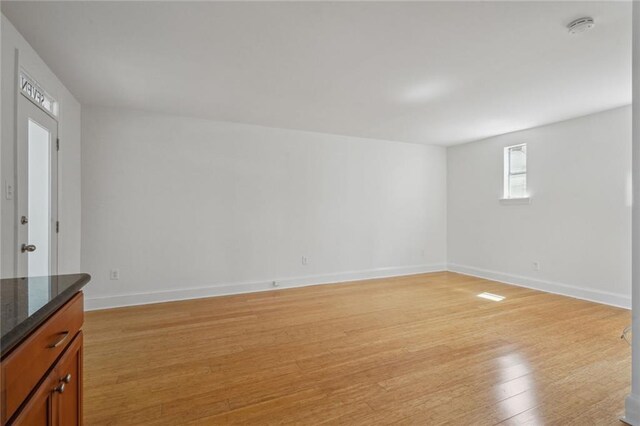 empty room with light hardwood / wood-style floors