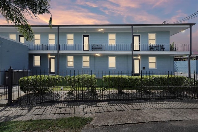 view of front of house with a balcony