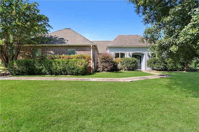 view of front of home with a front lawn