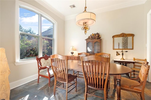 dining area with crown molding