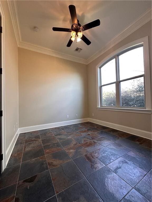 spare room with crown molding and ceiling fan