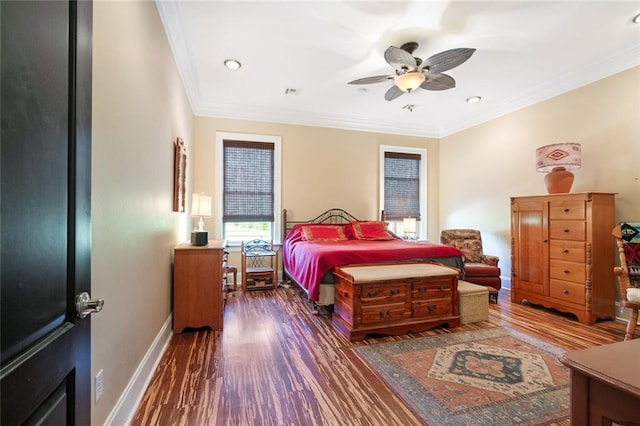 bedroom featuring ceiling fan, ornamental molding, and dark hardwood / wood-style floors