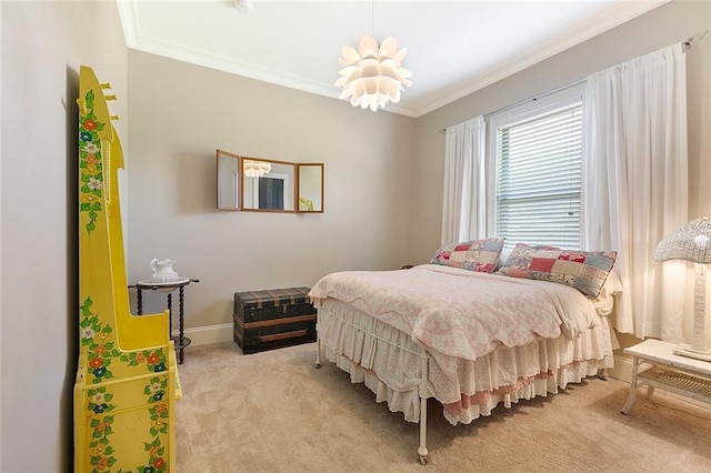 carpeted bedroom featuring ornamental molding and a chandelier