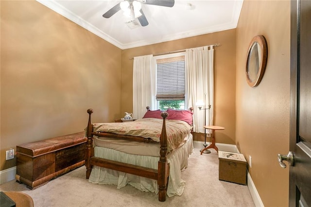 bedroom featuring crown molding, ceiling fan, and light carpet