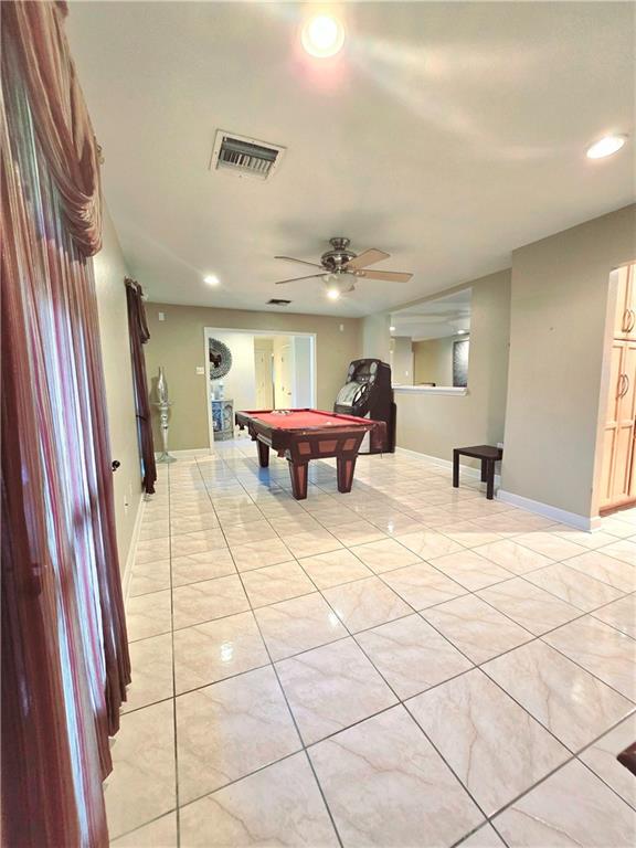 recreation room with ceiling fan, pool table, and light tile patterned floors