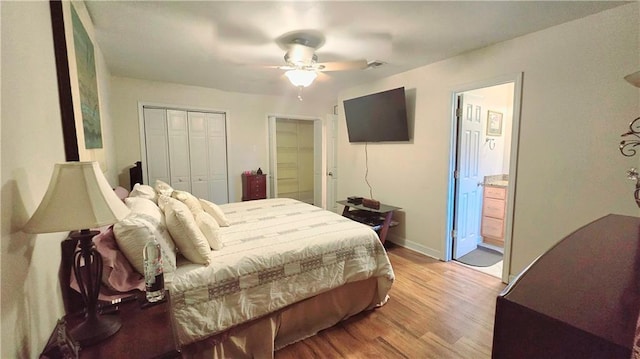 bedroom featuring ceiling fan, hardwood / wood-style floors, and ensuite bathroom