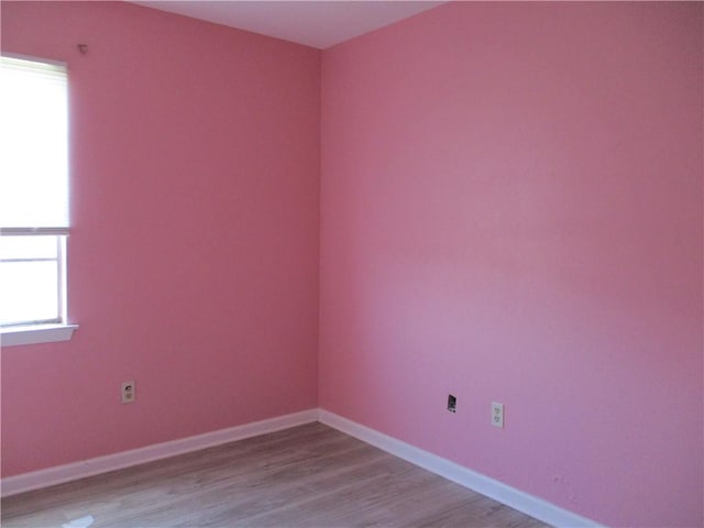 spare room with light wood-type flooring