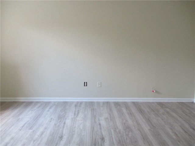 spare room featuring light wood-type flooring