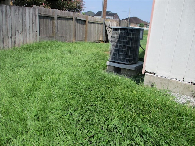 view of yard featuring central air condition unit