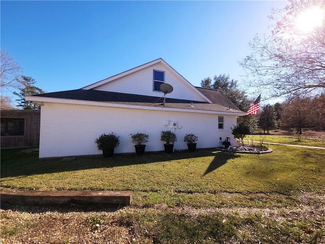 view of property exterior with a lawn