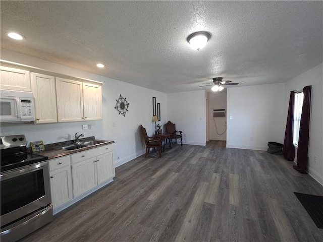 kitchen featuring white cabinetry, sink, dark hardwood / wood-style flooring, a textured ceiling, and stainless steel range with electric stovetop