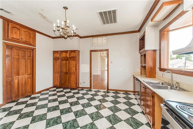 kitchen featuring stainless steel appliances, a notable chandelier, sink, ornamental molding, and decorative light fixtures