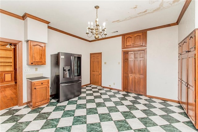 kitchen with stainless steel fridge, crown molding, decorative light fixtures, light hardwood / wood-style floors, and a chandelier