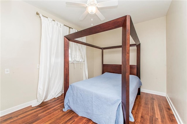 bedroom featuring ceiling fan and dark hardwood / wood-style floors