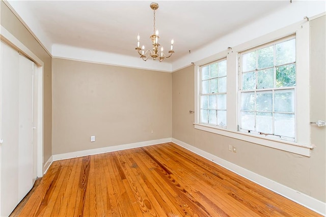 interior space featuring a chandelier and hardwood / wood-style flooring