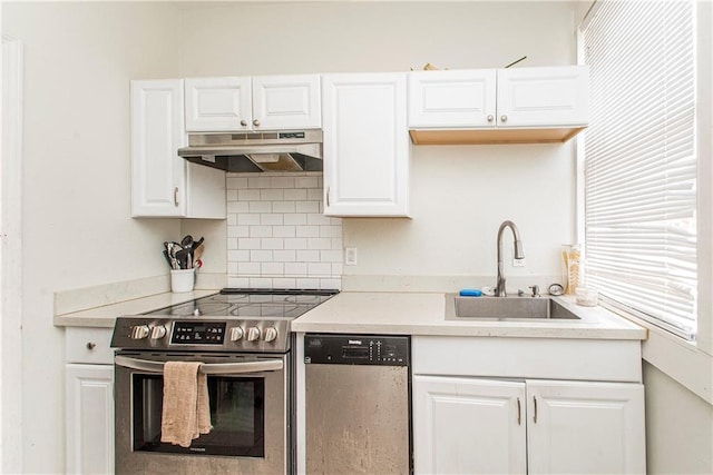 kitchen with white cabinets, stainless steel appliances, and sink