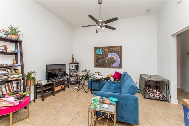 living room featuring light tile patterned flooring, ceiling fan, and high vaulted ceiling