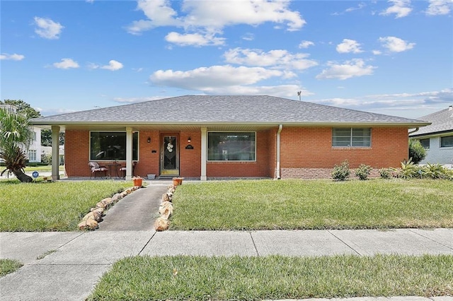 single story home with a front yard