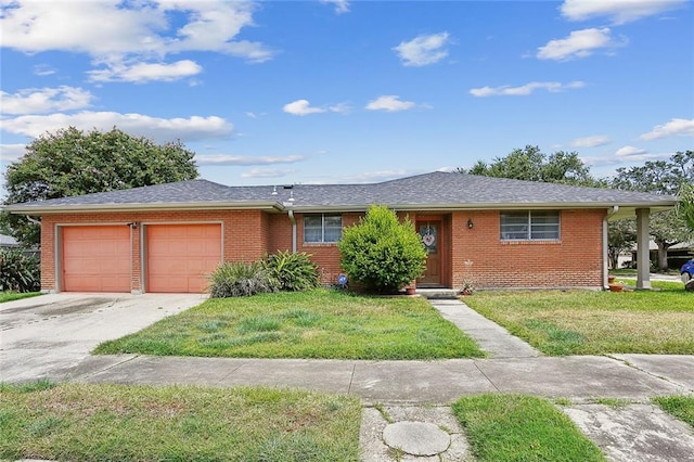 ranch-style home with a front yard and a garage