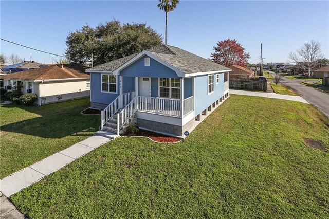 view of front of property with a front yard and a porch