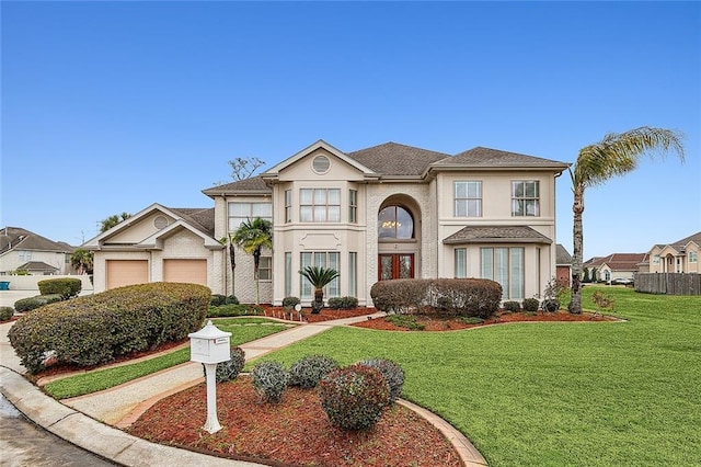 view of front facade featuring a front lawn and a garage