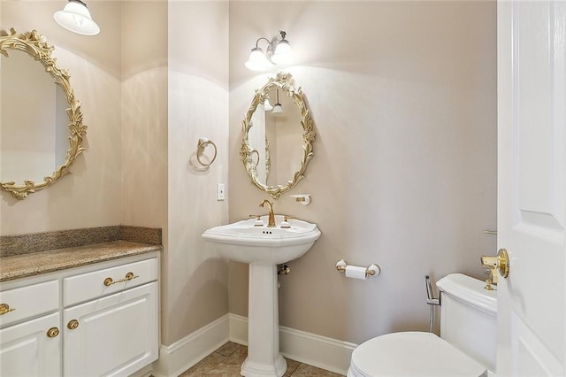 bathroom featuring tile patterned flooring and toilet