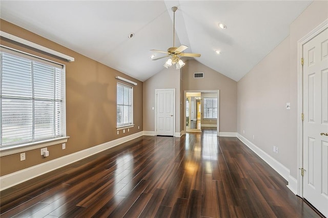 interior space with ceiling fan, lofted ceiling, and dark wood-type flooring