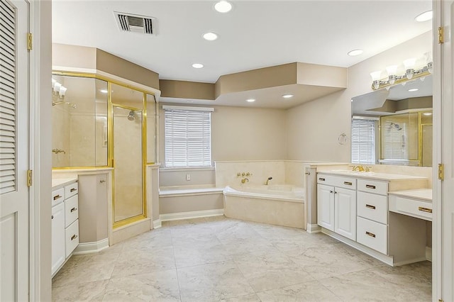 bathroom with vanity and separate shower and tub