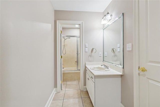 bathroom featuring tile patterned flooring, shower / bath combination with glass door, and vanity