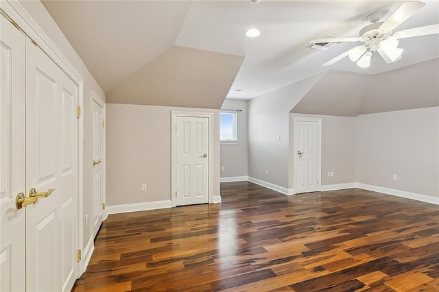 additional living space with vaulted ceiling, ceiling fan, and dark wood-type flooring