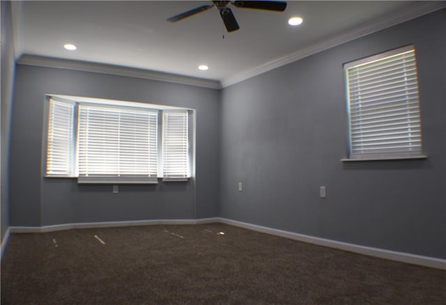 carpeted spare room featuring ceiling fan and crown molding