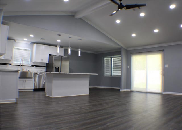 kitchen featuring a center island, dark hardwood / wood-style floors, stainless steel appliances, and white cabinetry