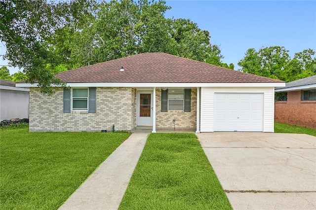 ranch-style house featuring a front yard and a garage