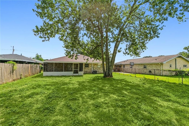 view of yard with a sunroom