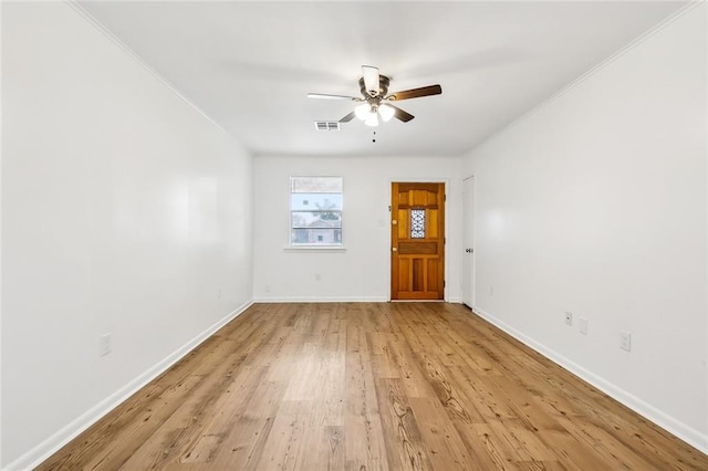 entryway with ceiling fan and light hardwood / wood-style floors