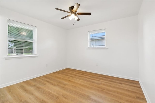 unfurnished room with ceiling fan and light hardwood / wood-style floors