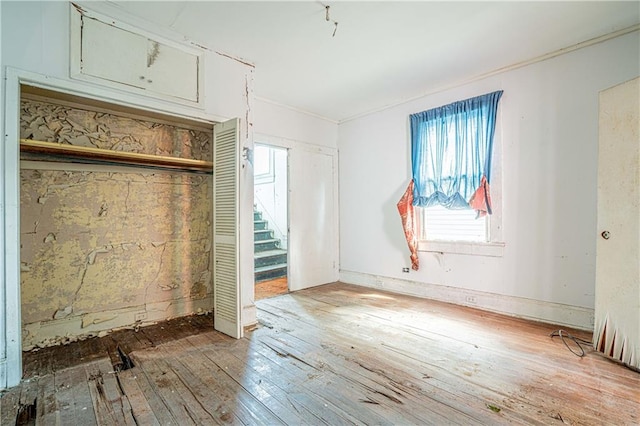 interior space with hardwood / wood-style floors and a closet