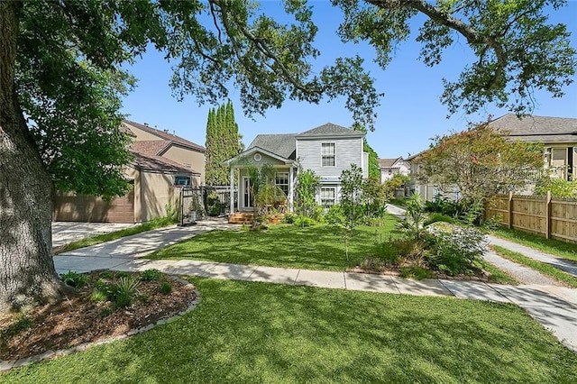 view of front of house featuring a front yard and a garage