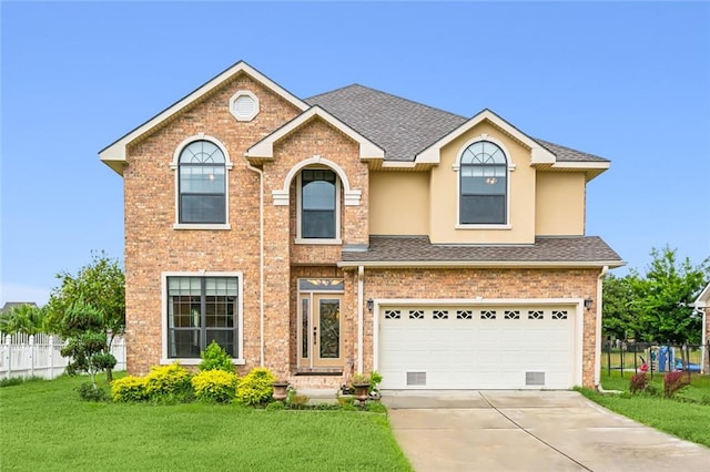 view of front of house with a front lawn and a garage