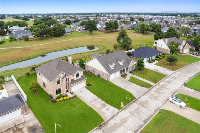 drone / aerial view with a water view