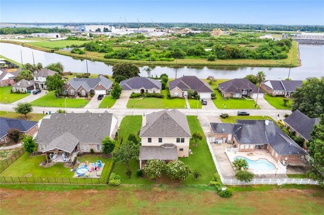 birds eye view of property with a water view