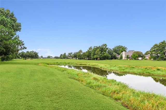 surrounding community with a water view